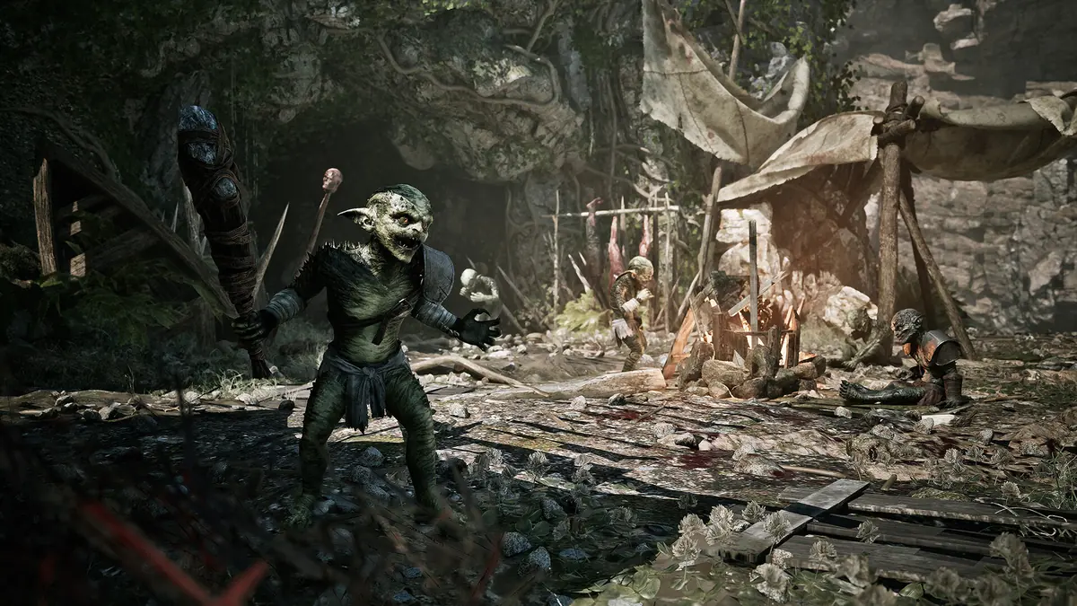 A Gothic Remake orc in a rocky camp with several figures gathered around a fire